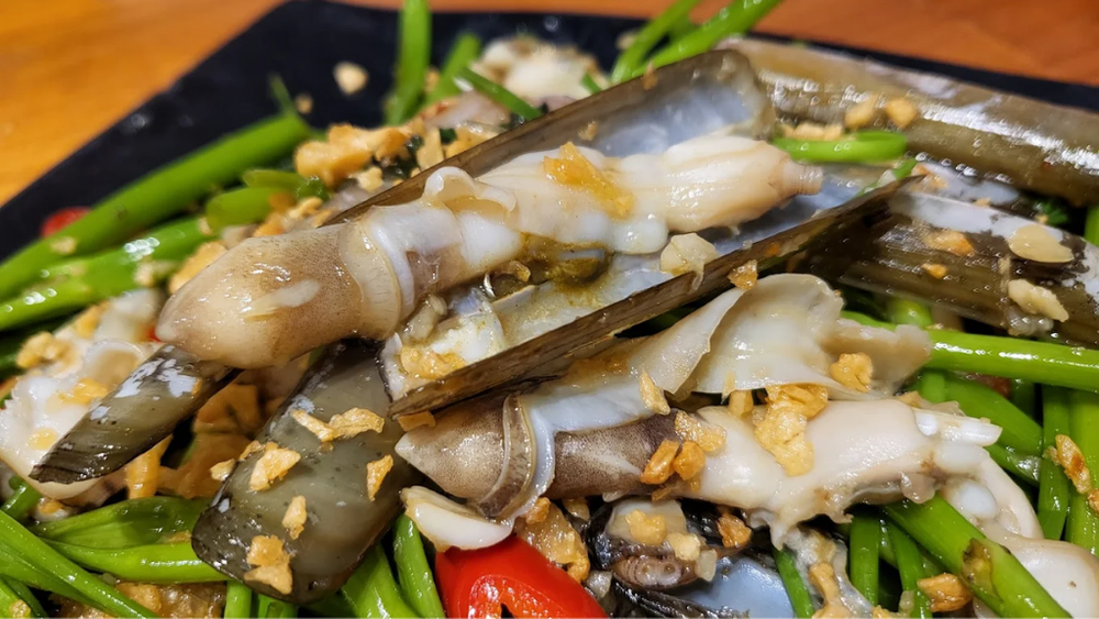 Ốc xào bơ tỏi "đỉnh của đỉnh" tại Hẻm Ốc Vân Đồn Nha Trang ẩn mình trong con hẻm nhỏ. (Nguồn: Internet)
